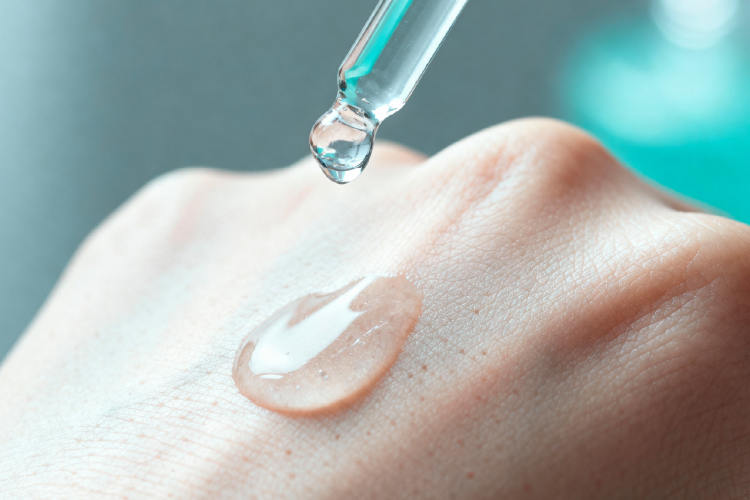 Dropper applying serum on hand, showing excellent penetration and absorption technology.