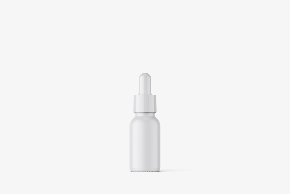 Eye Treatment Essence Bottle Mockup Small glass bottle mockup for eye creams or eye serums, suitable for anti-aging, brightening, or targeted eye area care products.